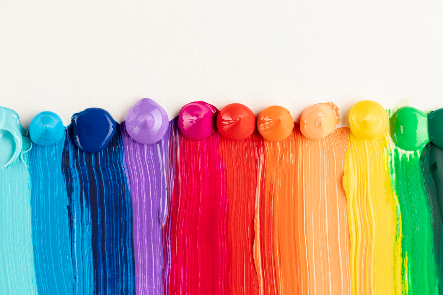 Colorful paint trails on white background.